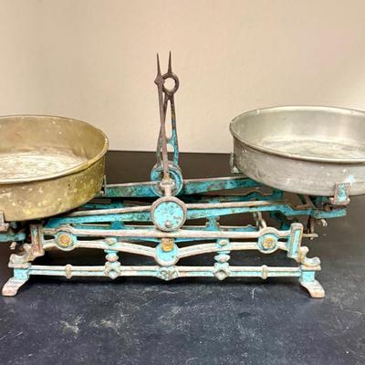 Sale Photo Thumbnail #649: This is a vintage cast iron balance scale with brass pans.