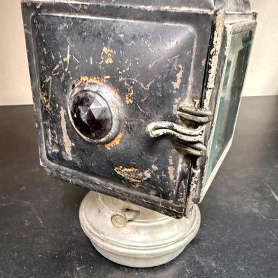 Sale Photo Thumbnail #660: A nice old kerosene automobile or carriage buggy lamp. Model 143, manufactured by C.M. Hall Co, out of Detroit, Mich U.S.A., per etchings on top. This company dissolved in 1926 so this item is definitely from the early 1900s era.