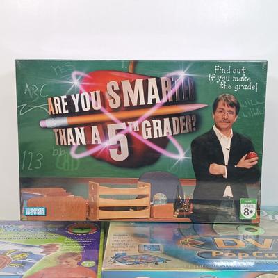 LOT 129: NIP Games - Trivial Pursuit DVD Pop Culture, PictureMate! 2nd Edition, Words with Friends & More