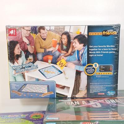 LOT 129: NIP Games - Trivial Pursuit DVD Pop Culture, PictureMate! 2nd Edition, Words with Friends & More