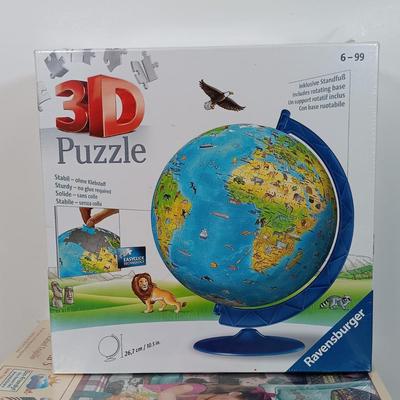 LOT 154: Set of (9) Puzzles - 3D Globe Puzzle with 1000 Pc and 500 Pc Puzzles