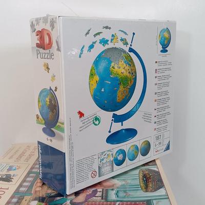 LOT 154: Set of (9) Puzzles - 3D Globe Puzzle with 1000 Pc and 500 Pc Puzzles