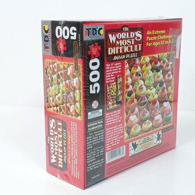 LOT 156: NIP Set of (8) 500 and 1000 Pc Puzzles