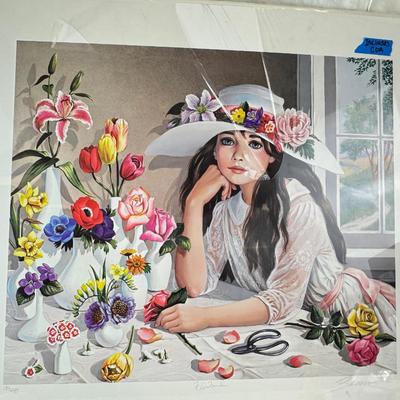 Sale Photo Thumbnail #364: This is a "Floribunda" lithograph print by the artist Pati Bannister The print is signed and numbered, with an edition size of 485.
It was created in 1988. The image features a young woman with long dark hair, wearing a white dress and a wide-brimmed hat 