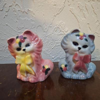 vintage ceramic cat salt and pepper shakers, one pink and one blue gray cat.