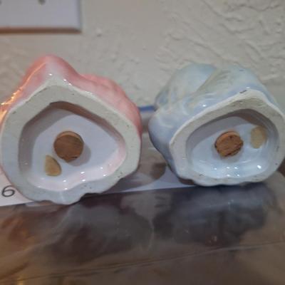 vintage ceramic cat salt and pepper shakers, one pink and one blue gray cat.