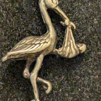 double link sterling silver charm bracelet with stork and other charm- weights 18 grams