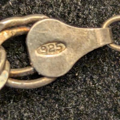 double link sterling silver charm bracelet with stork and other charm- weights 18 grams