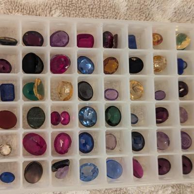 collection of various polished gemstones for jewelry making-
