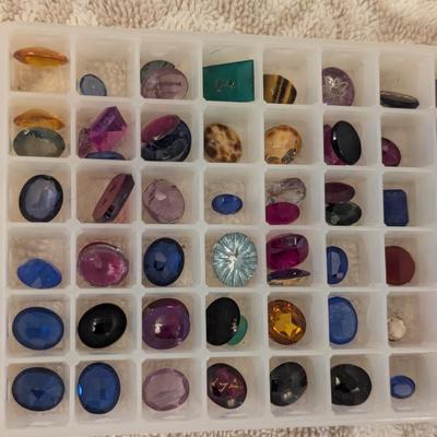 collection of various polished gemstones for jewelry making-
