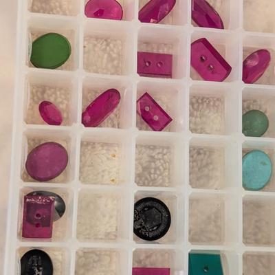 assortment of multi colored glass or gemstones for jewelry making