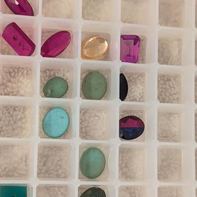 assortment of multi colored glass or gemstones for jewelry making