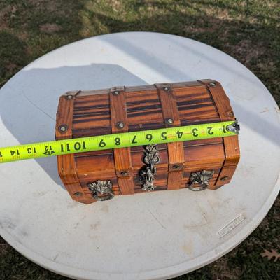 vintage wooden pirate treasure chest jewelry box with lion head accents.