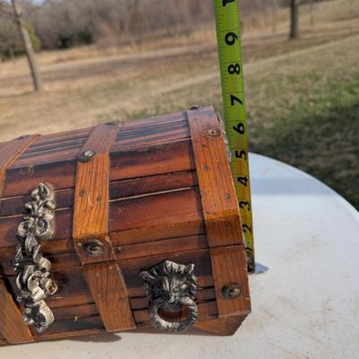 vintage wooden pirate treasure chest jewelry box with lion head accents.