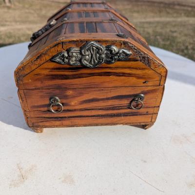 vintage wooden pirate treasure chest jewelry box with lion head accents.