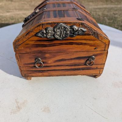 vintage wooden pirate treasure chest jewelry box with lion head accents.