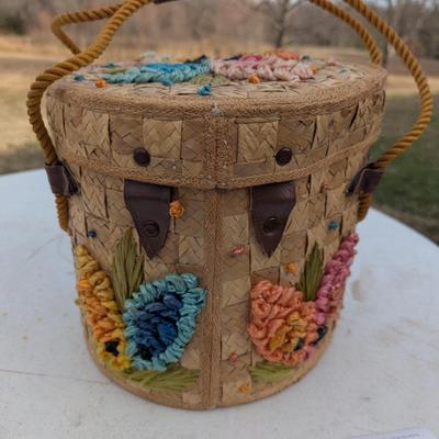 vintage raffia and straw bucket-style basket purse with a floral motif and rope handles