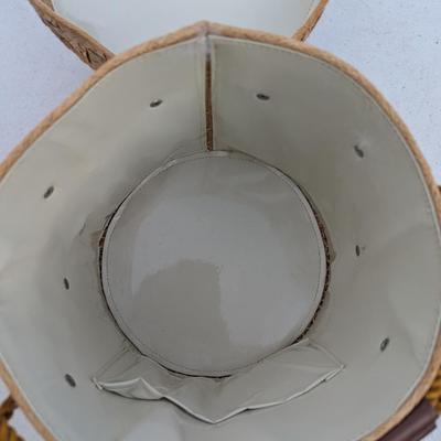 vintage raffia and straw bucket-style basket purse with a floral motif and rope handles