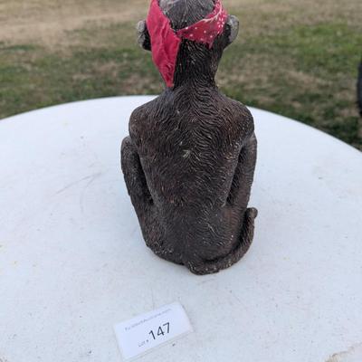 Money statue with red bandana