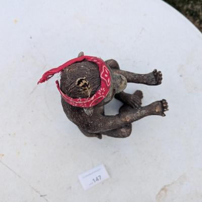 Money statue with red bandana