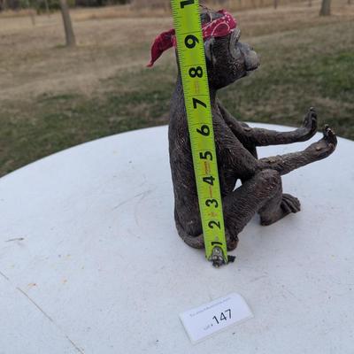 Money statue with red bandana