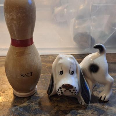 Mismatched salt and pepper shaker- basset hound for pepper and bowling pin for salt.