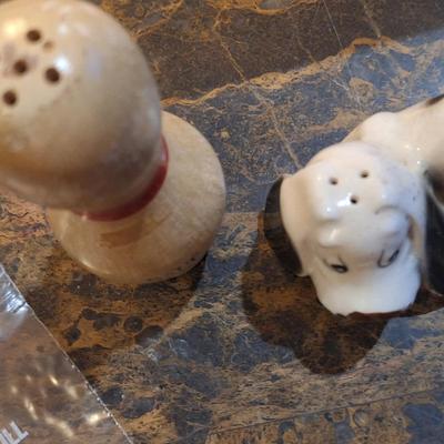 Mismatched salt and pepper shaker- basset hound for pepper and bowling pin for salt.