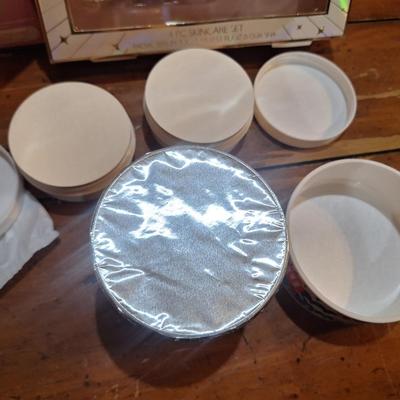 body butter, facial cleaning brush and facial serums