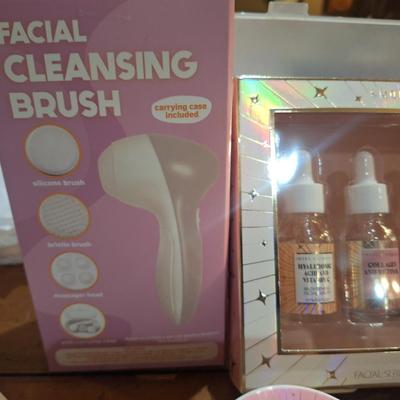 body butter, facial cleaning brush and facial serums