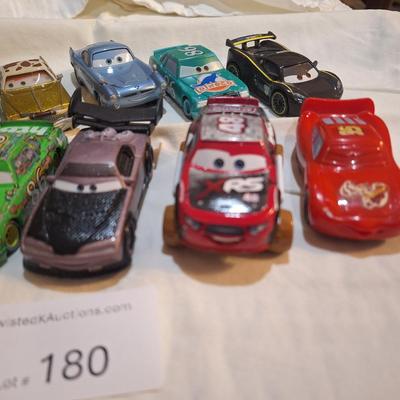 mixed lot of Disney pixar cars and other pocket size vehicles.