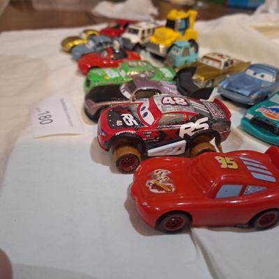 mixed lot of Disney pixar cars and other pocket size vehicles.