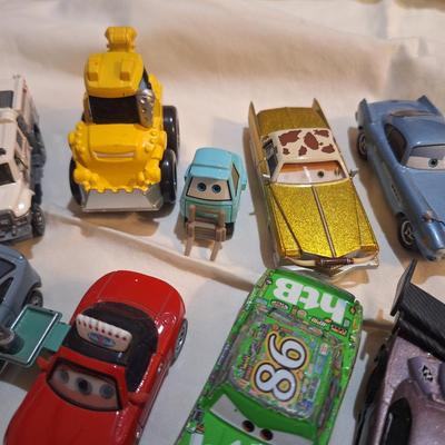 mixed lot of Disney pixar cars and other pocket size vehicles.