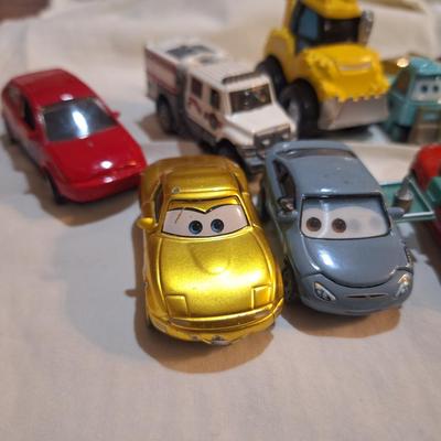 mixed lot of Disney pixar cars and other pocket size vehicles.