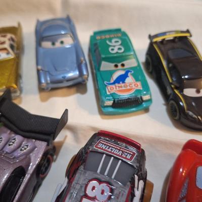 mixed lot of Disney pixar cars and other pocket size vehicles.