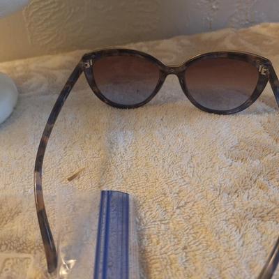 Foster Grant sunglasses with tortoise shell colored frames.