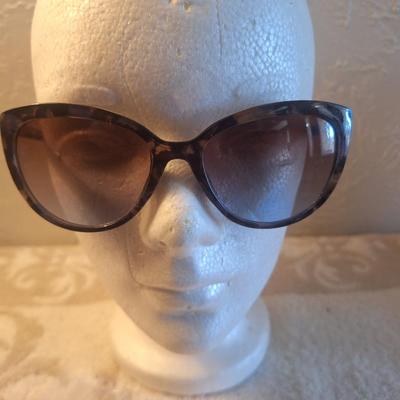 Foster Grant sunglasses with tortoise shell colored frames.