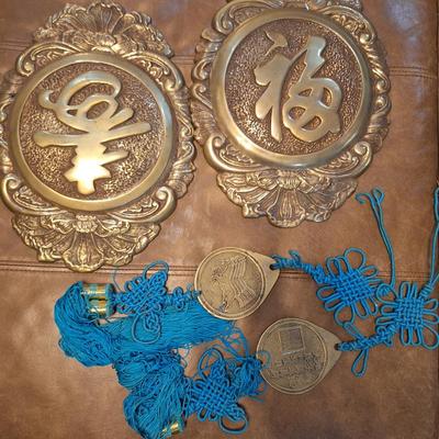 vintage brass Chinese wall hanging featuring characters for good forture and longevity