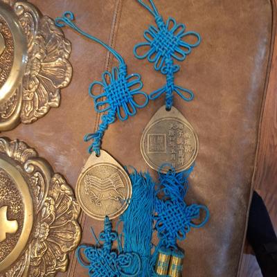 vintage brass Chinese wall hanging featuring characters for good forture and longevity