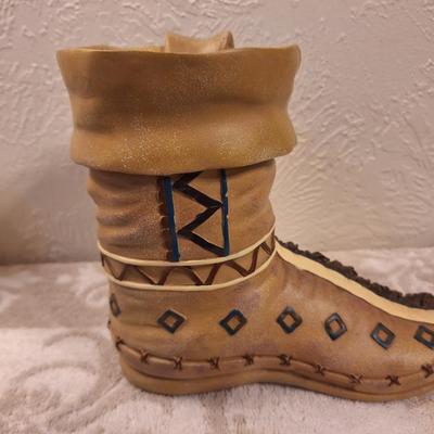 Decorative moccasin boot vase or planter- seems to be resin.