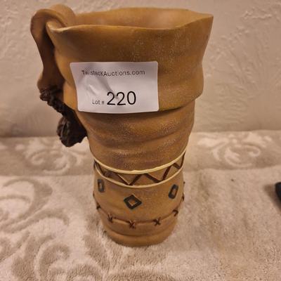 Decorative moccasin boot vase or planter- seems to be resin.