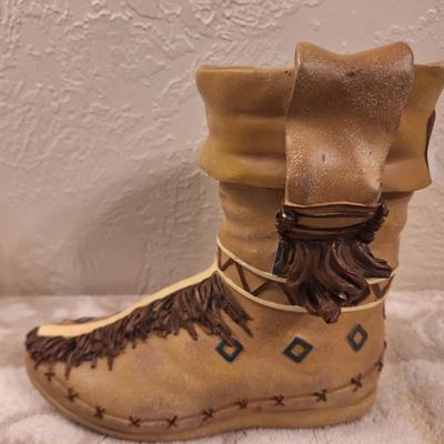 Decorative moccasin boot vase or planter- seems to be resin.