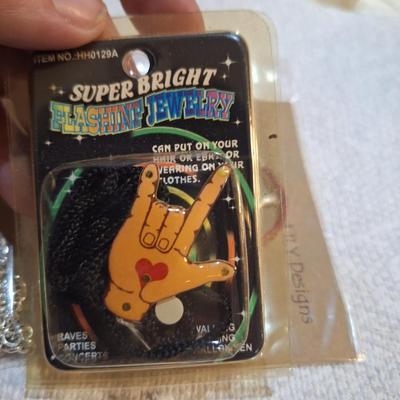 3 pieces of jewelry 2 which have the I love you sign language symbol