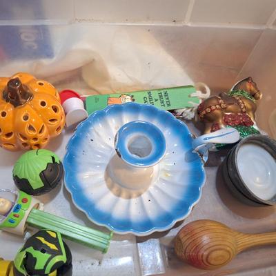 candlestick holder, pez dispenser, fisher price person and other misc small items