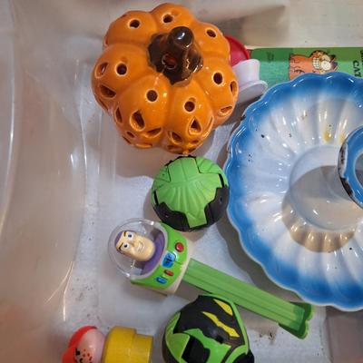 candlestick holder, pez dispenser, fisher price person and other misc small items