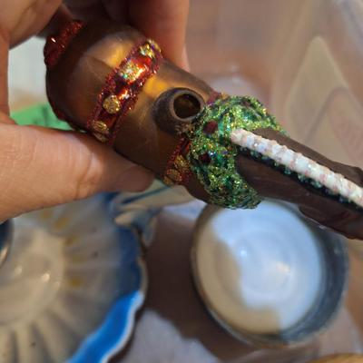 candlestick holder, pez dispenser, fisher price person and other misc small items