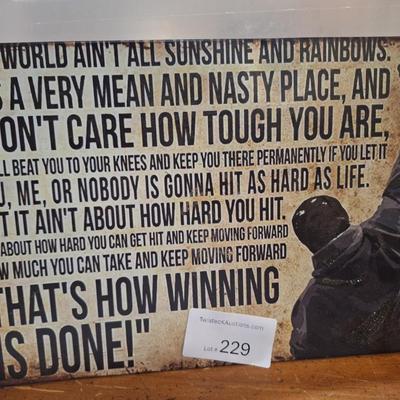 Metal sign with Rocky Balboa and his famous speech about how winning is done.