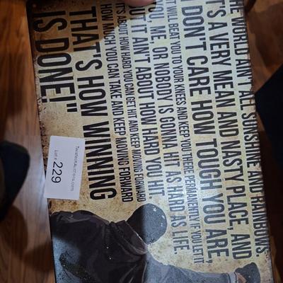 Metal sign with Rocky Balboa and his famous speech about how winning is done.