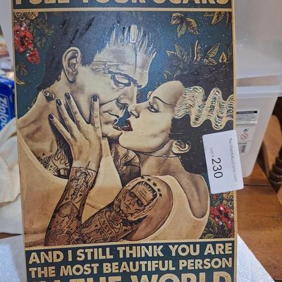 small metal sign, with the Bride of Frankenstien- I see your scars