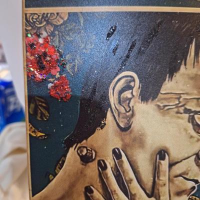 small metal sign, with the Bride of Frankenstien- I see your scars