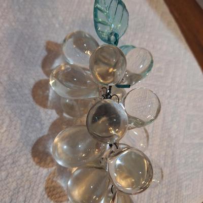 set of two vintage clusters of hand-blown clear glass grapes, one has green leaves one has clear.